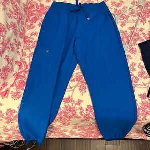 Koi cureology blue royal scrubs! Size small in both top and bottom.